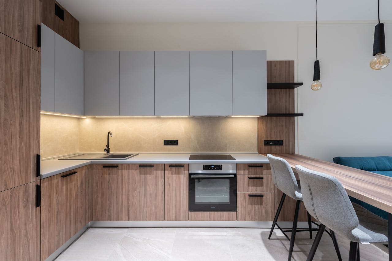 about-us Sleek contemporary kitchen interior with wood accents and modern appliances.